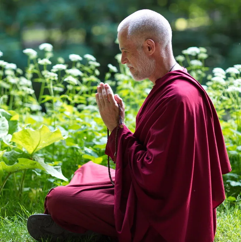Lama Lakshyong in meditative pose in the forest